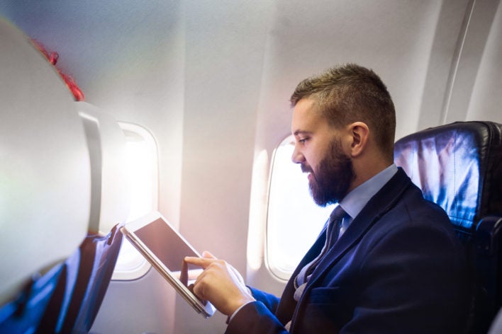 Business-Man-On-Airplane