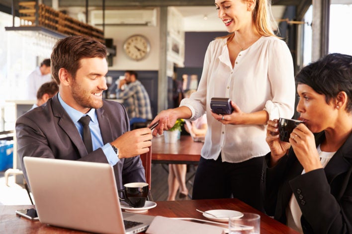 businessman paying with credit card