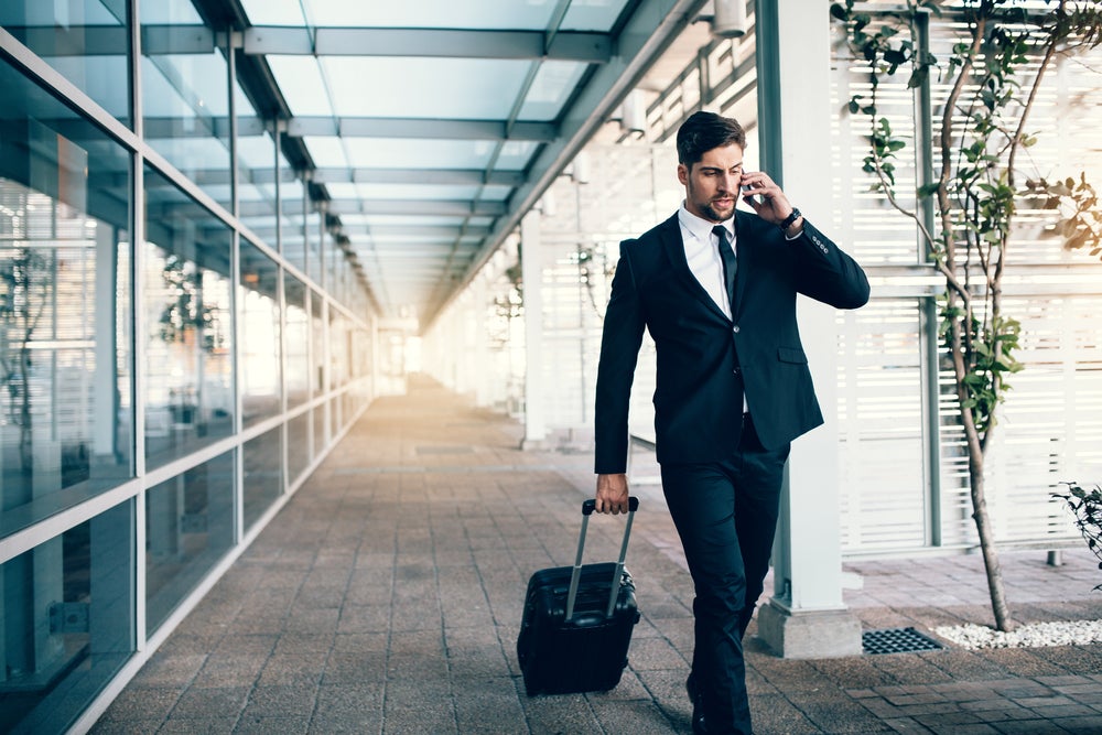 Business Man Walking with Suitcase