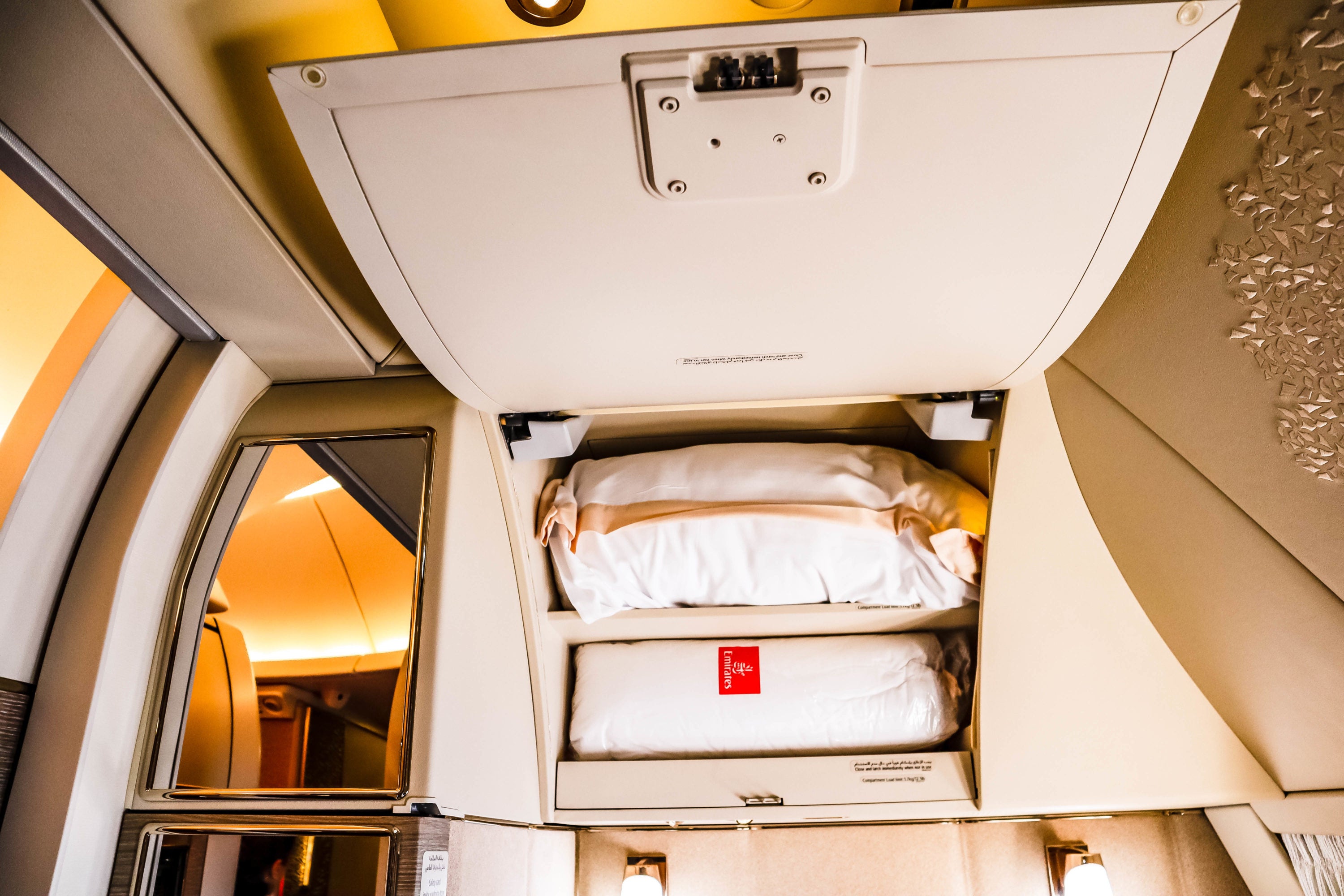 Storage above the seat for bedding