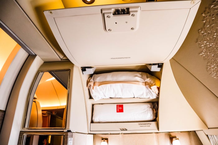 Storage above the seat for bedding