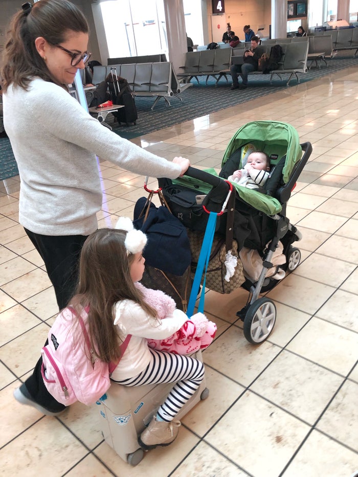Family With A Stroller In The Airport