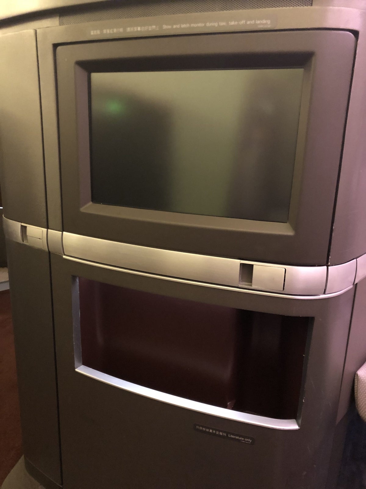 Cathay Pacific 777 first class in-flight monitor and storage compartment