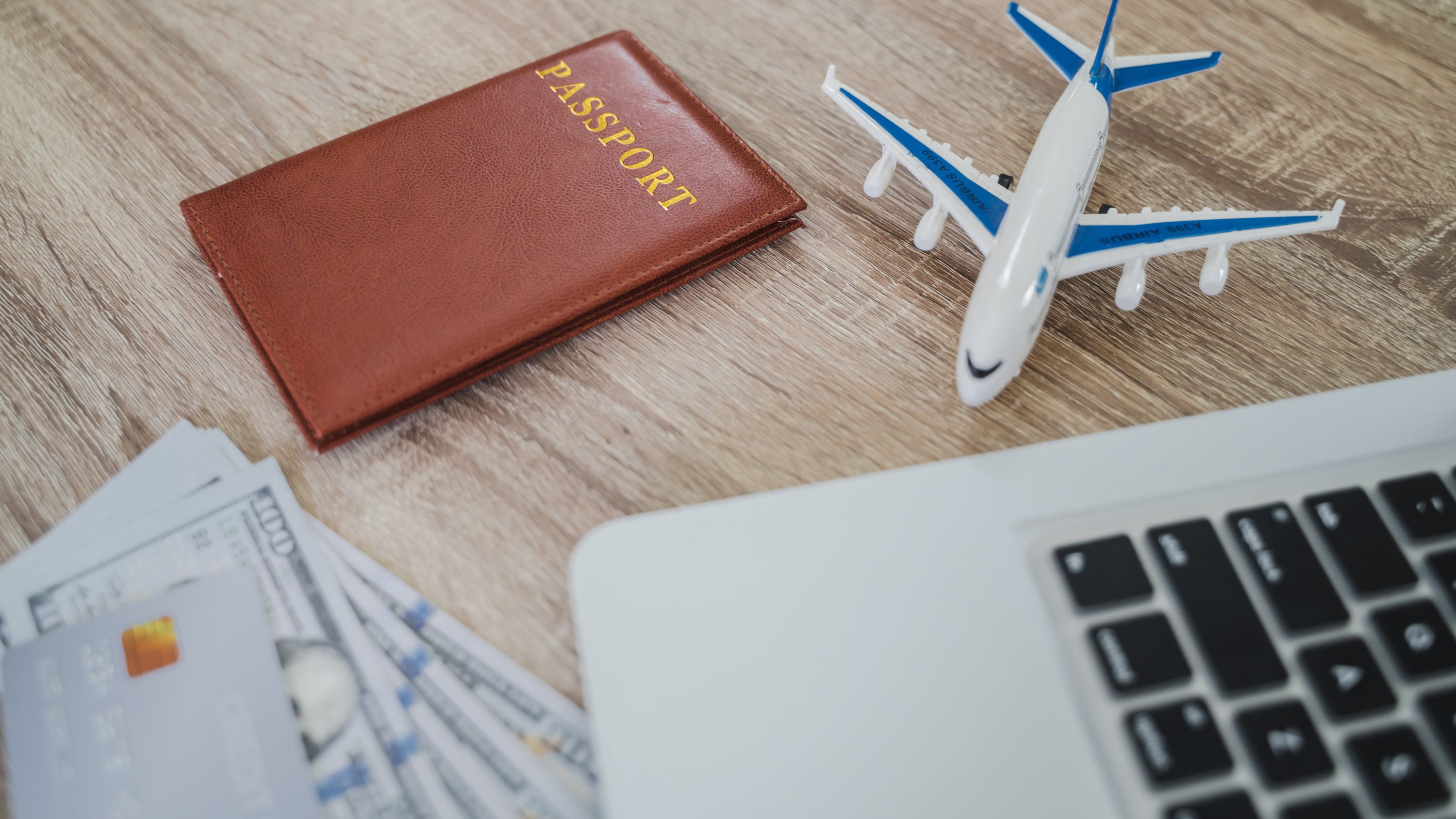 Booking travel online passport laptop