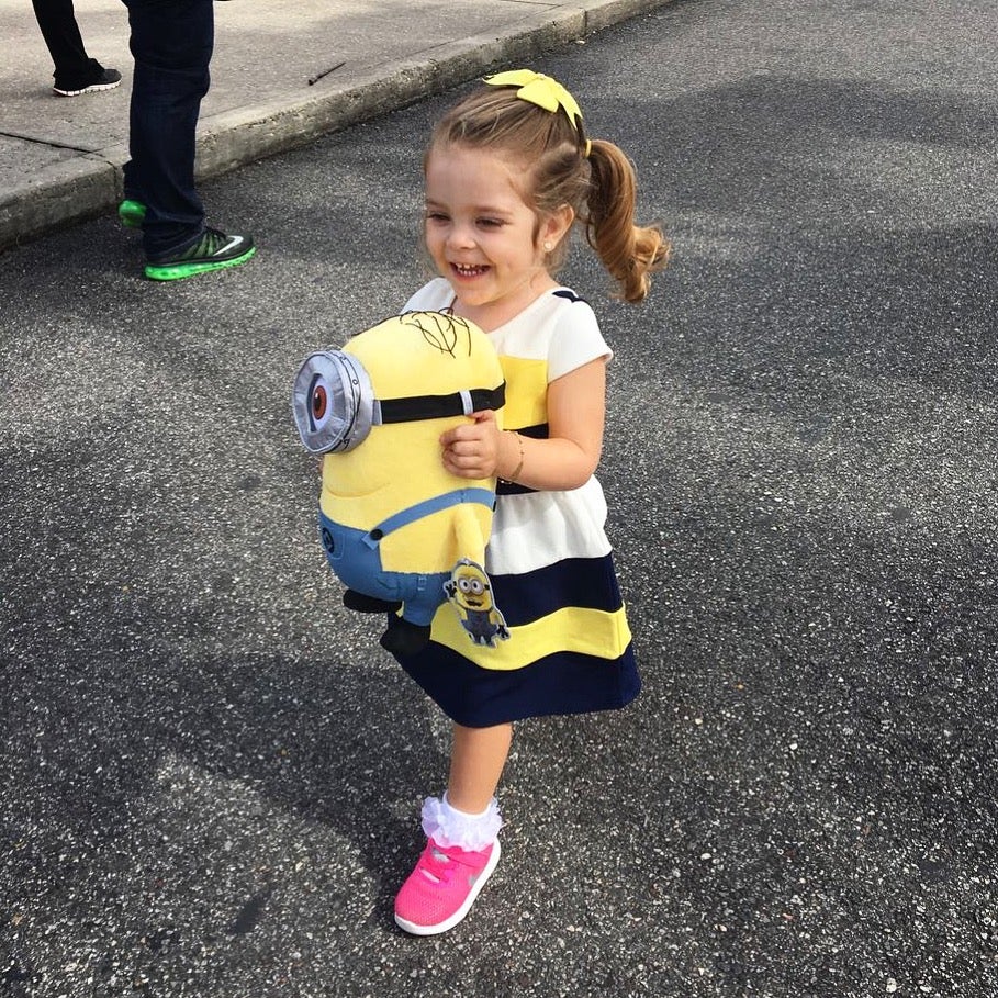 Toddler with Minion doll at Universal Orlando