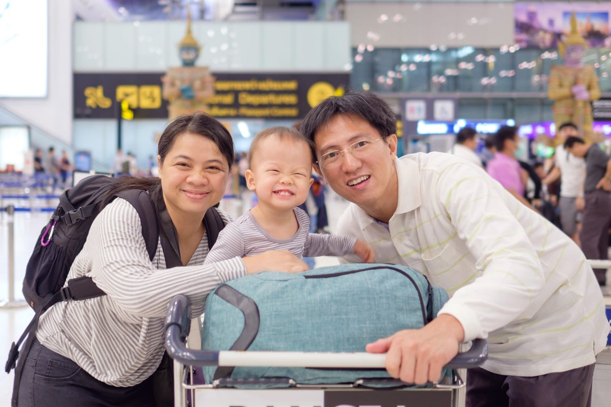 Family with baby at airport