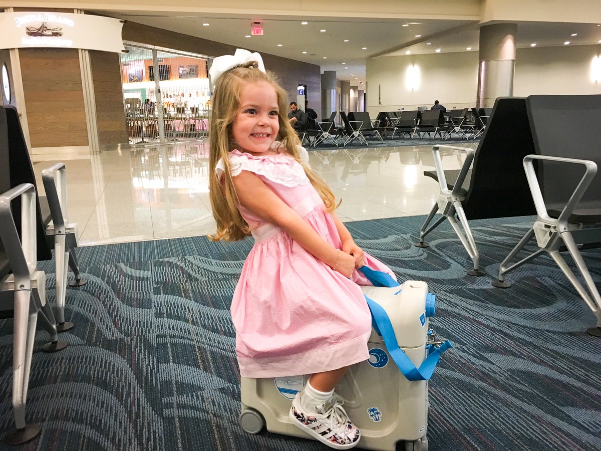 Little girl on Jetkids Bedbox in airport