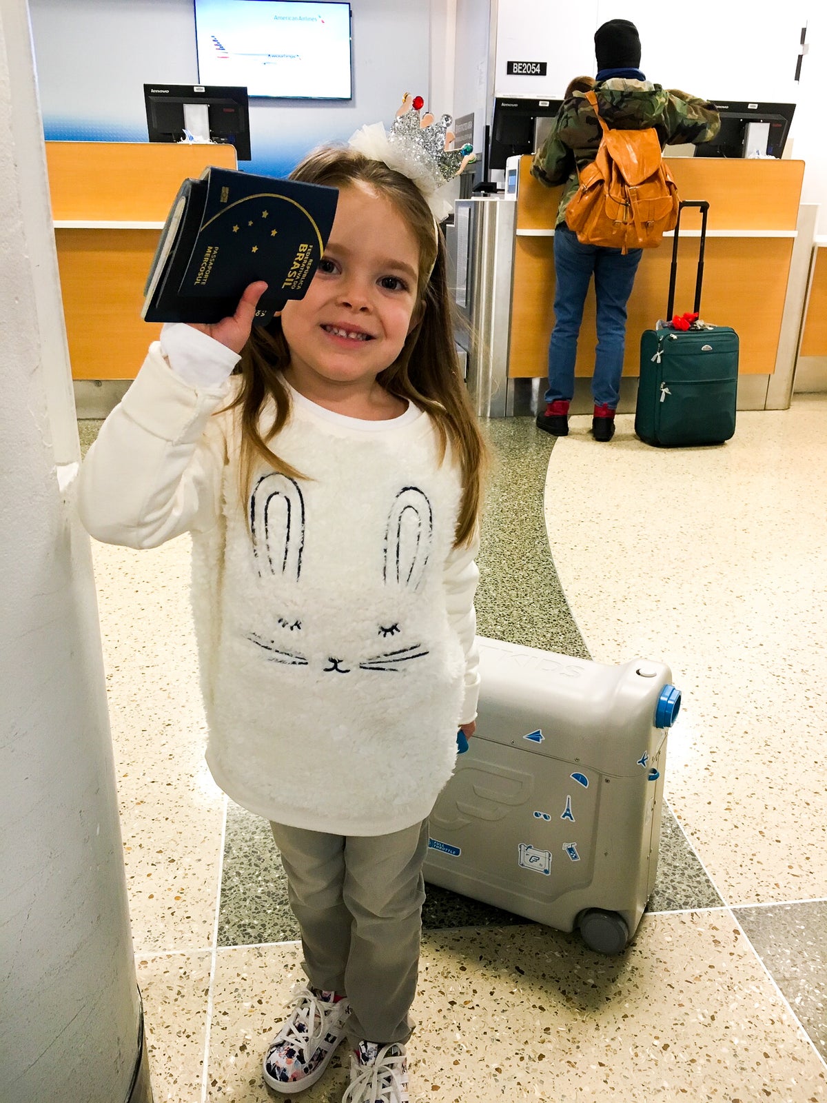 Little girl with passports at BOS airport