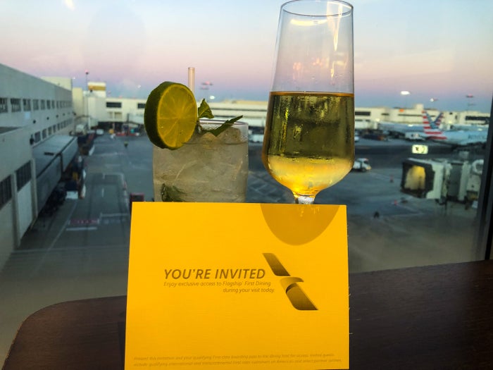 American Airlines Flagship First Dining LAX tarmac view with Krug and mojito American Airlines Flagship First Dining LAX tarmac view with Krug and mojito