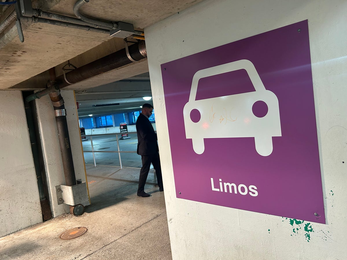 Boston Logan rideshare Uber Lyft sign Boston Logan Airport limo sign