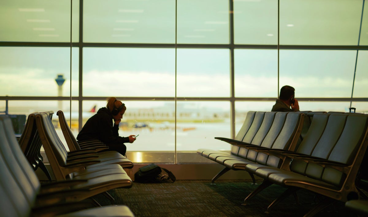 People Sitting in An Airport Terminal