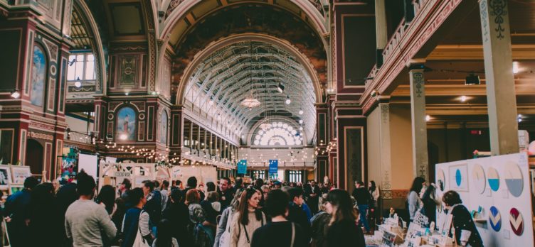 People Walking A Tradeshow Floor