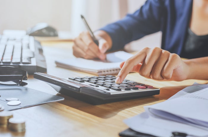 Person Using Calculator