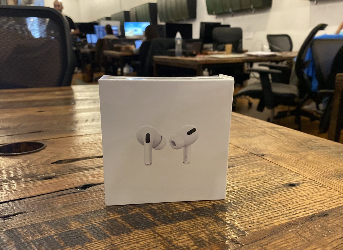 AirPods Pro Box on A Table in A Coworking Space