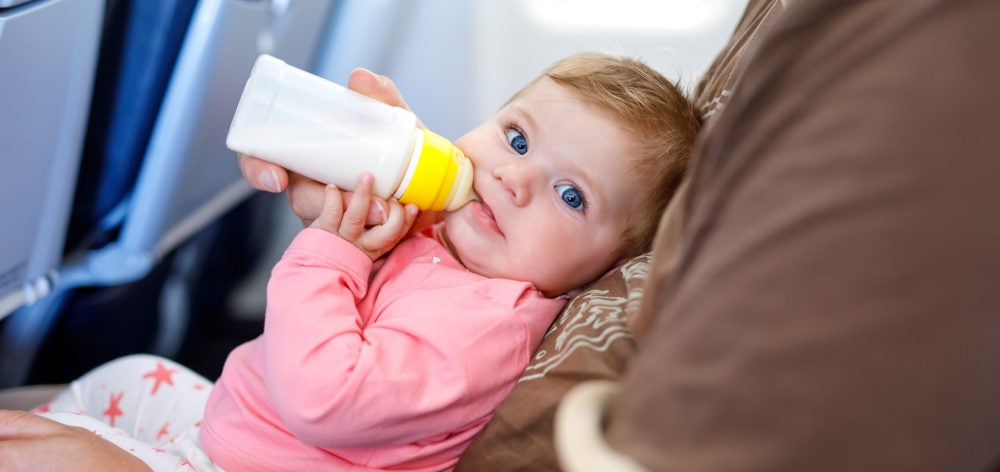 Baby Drinking Milk on a Plane