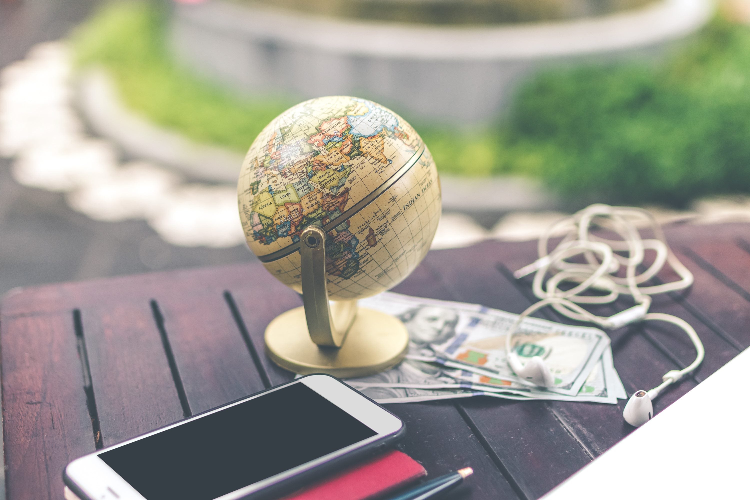 Globe on Desk with Travel Money