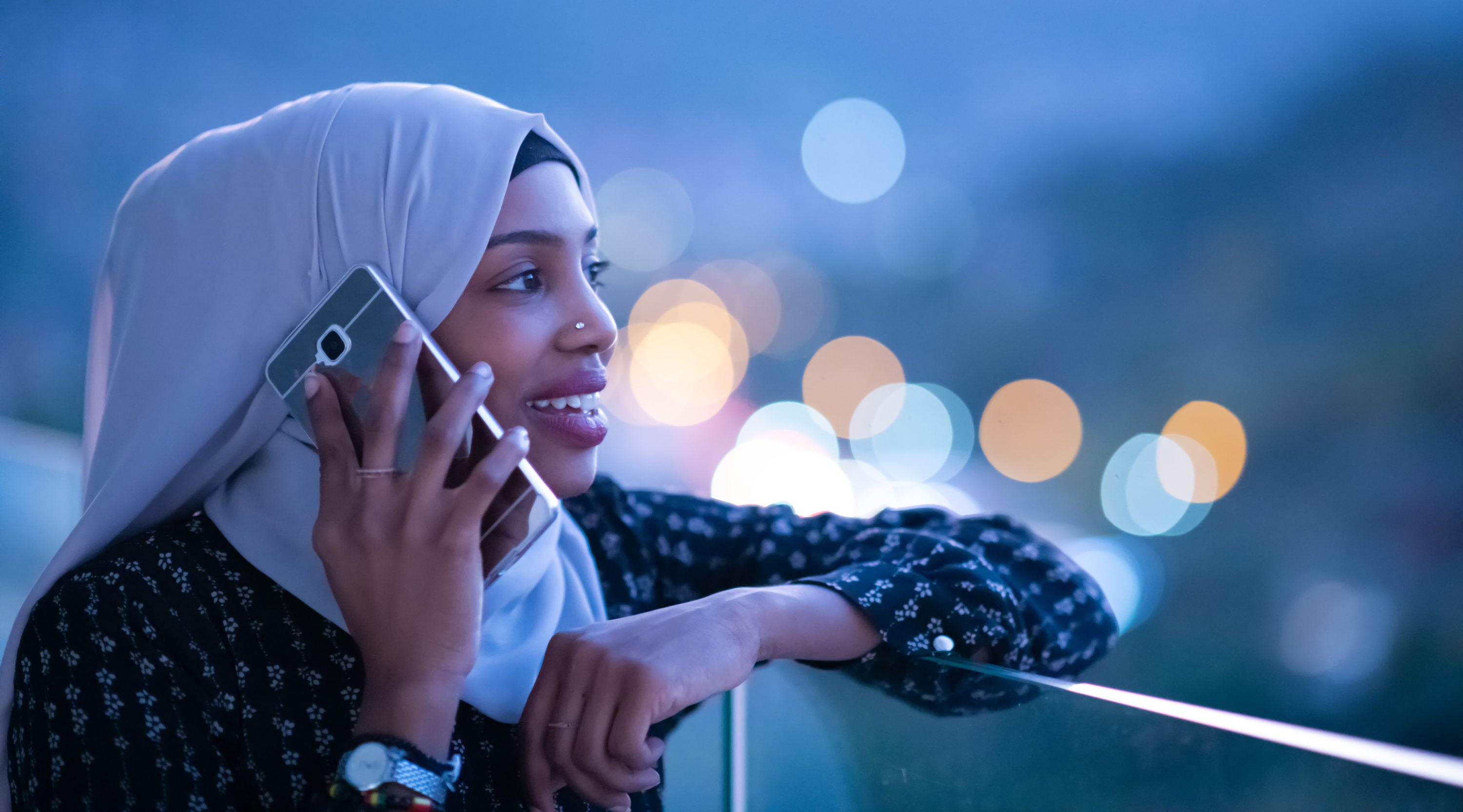 Woman on phone at dusk