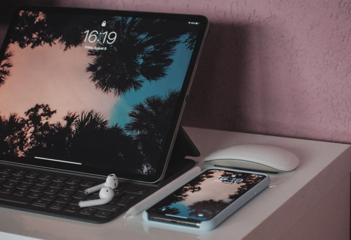 iPad AirPods and iPhone And Various Apple Products on A Table