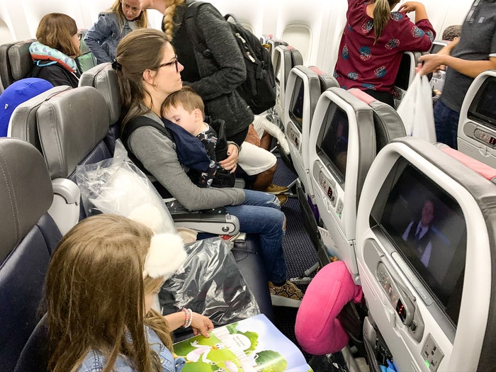 Family flying American Airlines economy 777-200