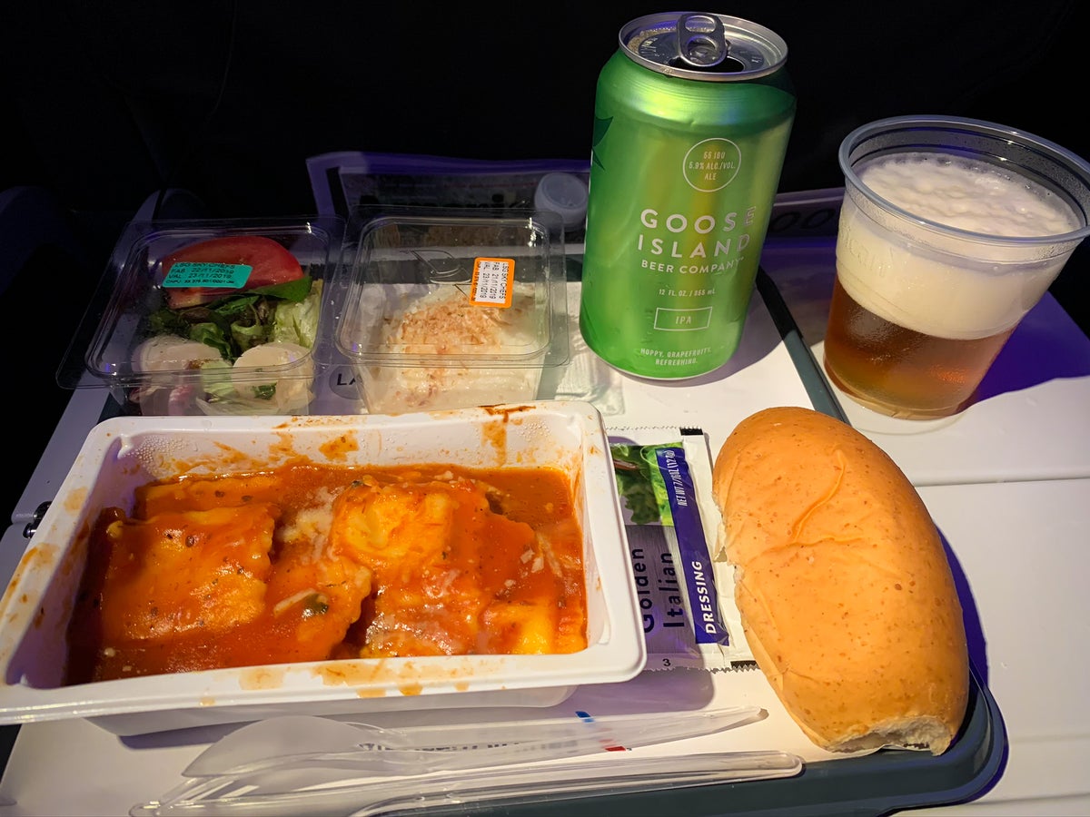 American Airlines 777-200 economy meal ravioli and a Goose Island IPA