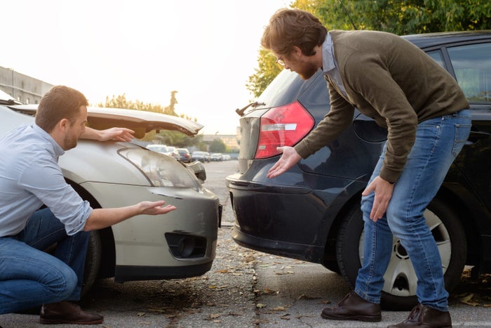 Two Men Talking After Minor Car Accident