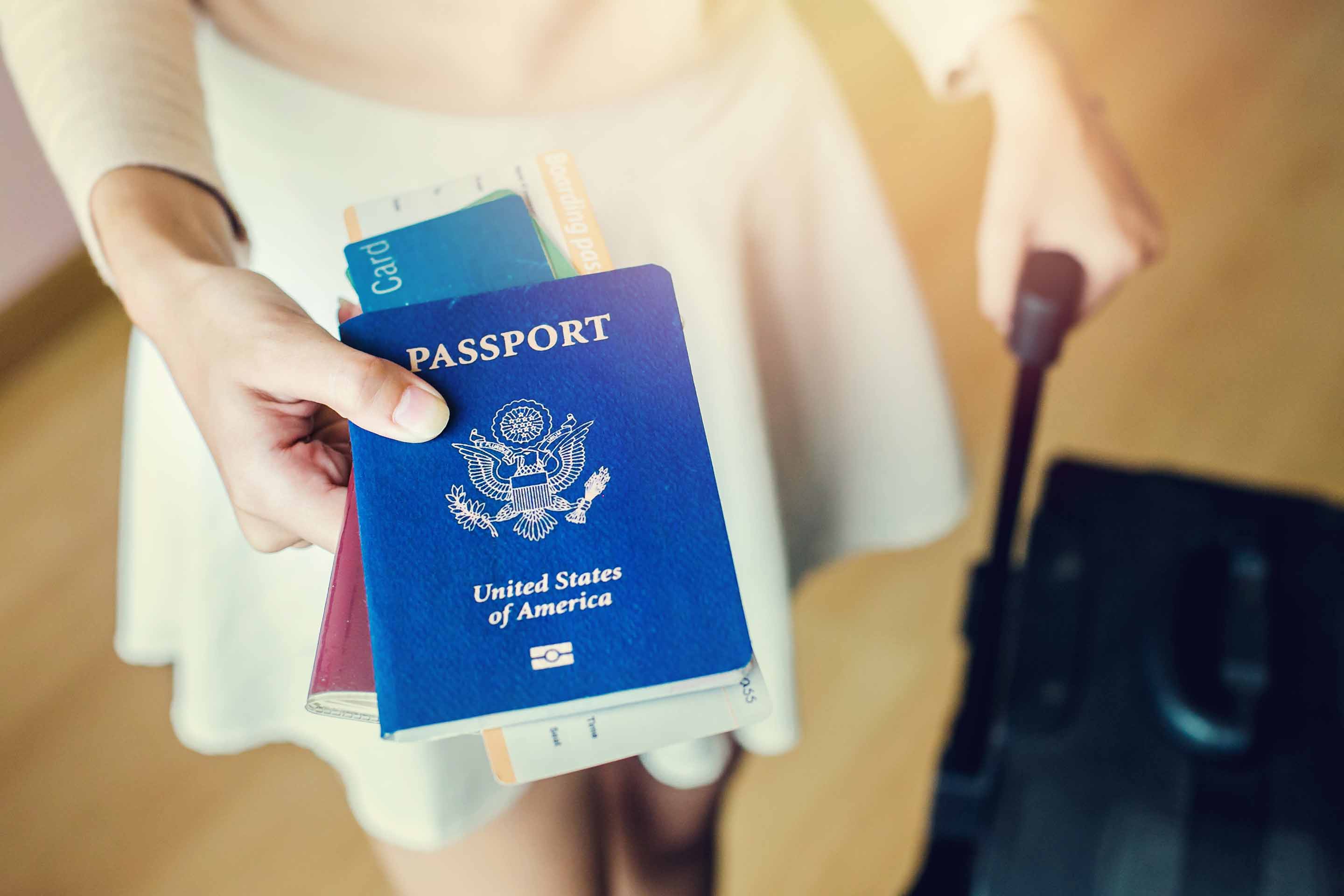 Woman with passport and bag