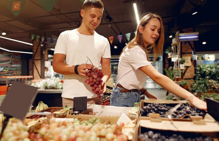 Couple buying grapes Couple buying grapes