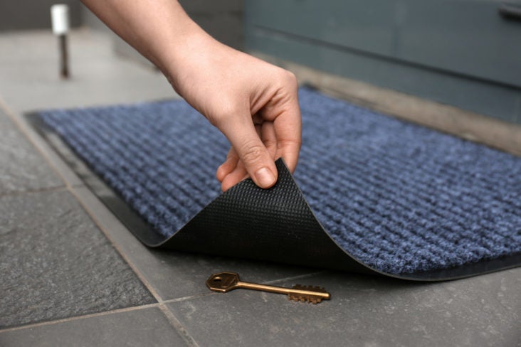Key hidden under doormat Key hidden under doormat
