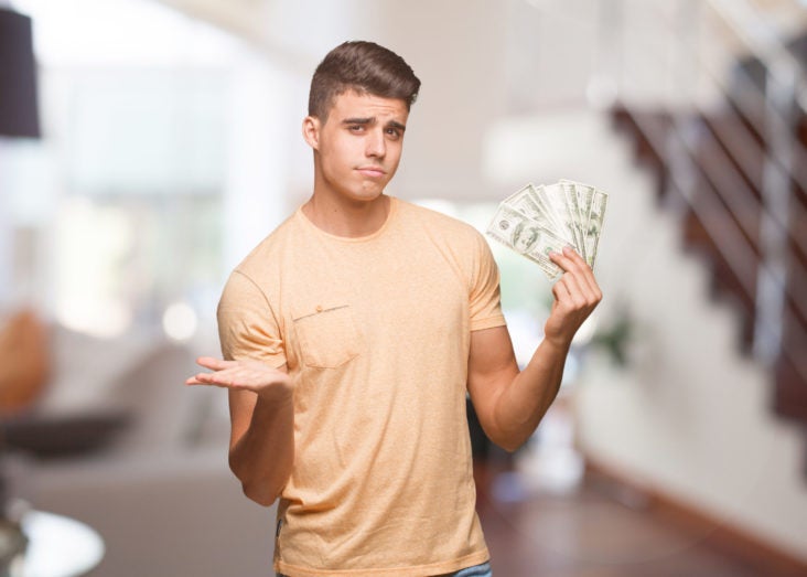 Points versus cash Points versus cash man holding cash