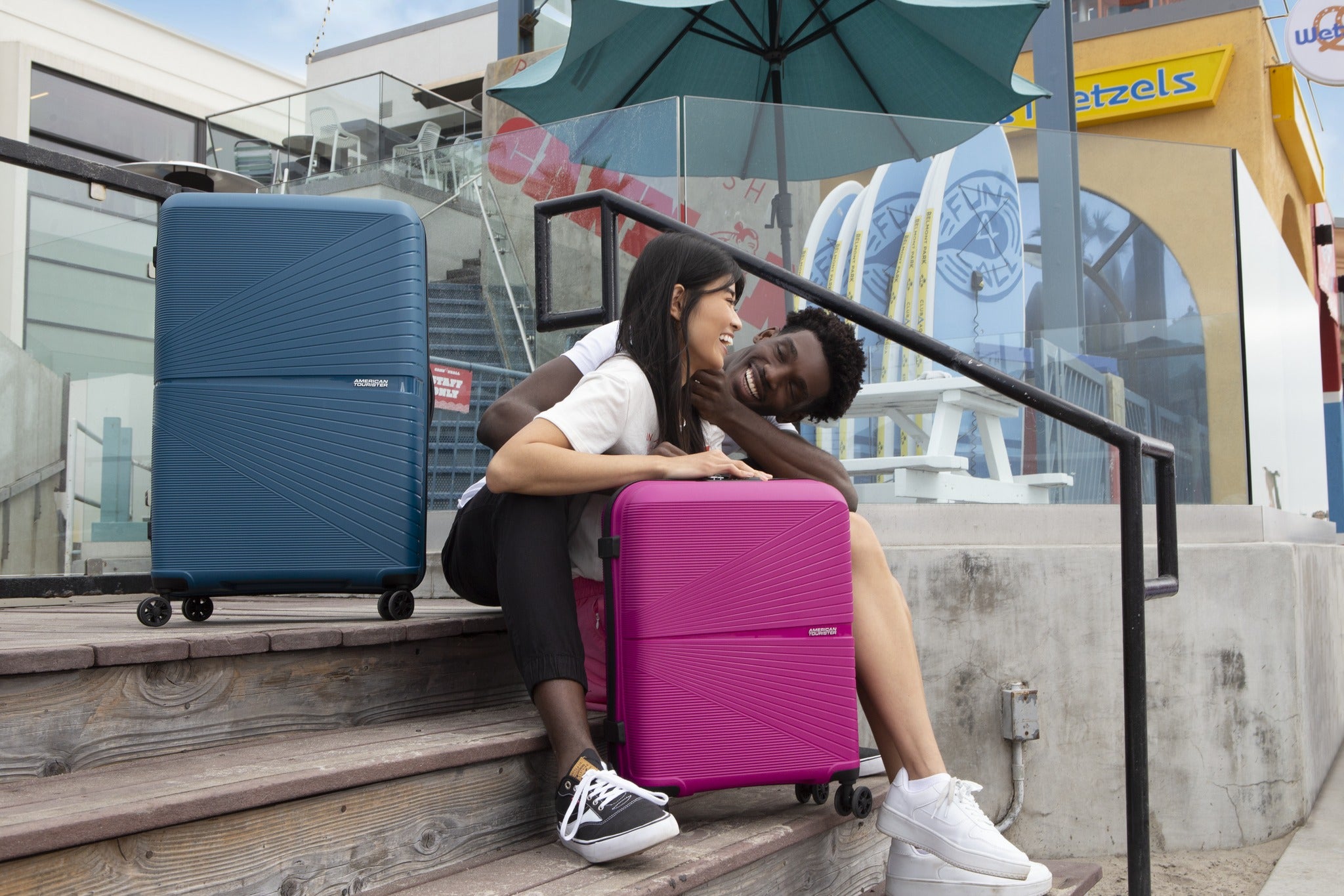 American Tourister couple with luggage