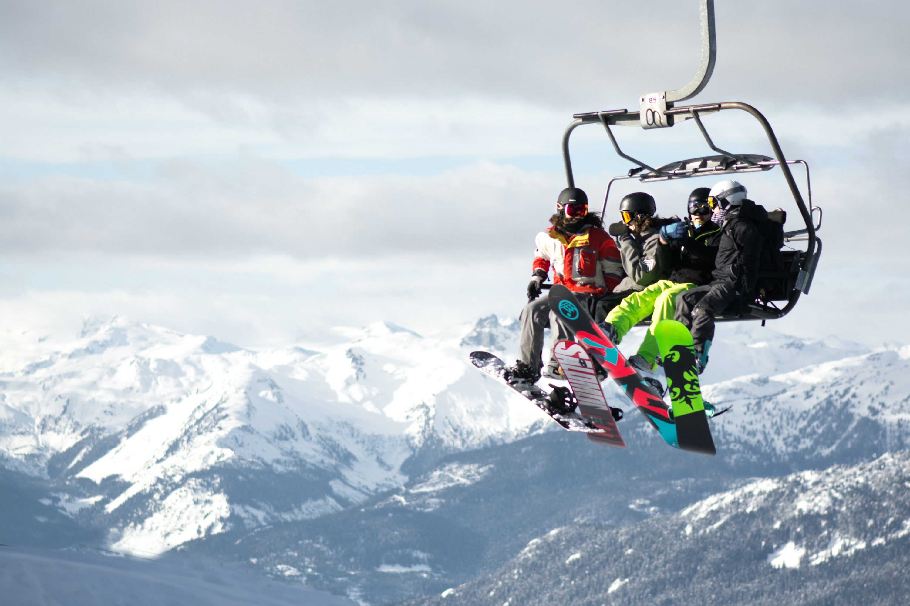 Snowboarders on chair lift