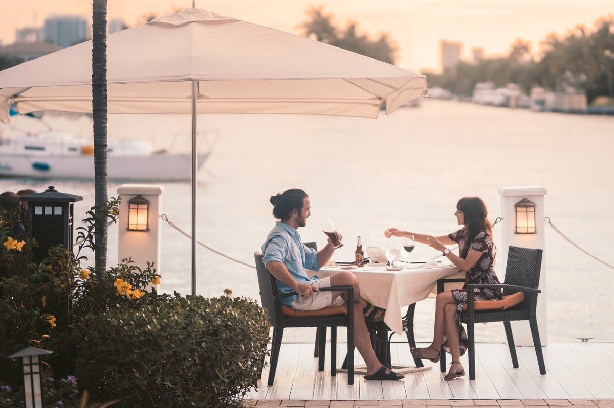 Couple dining out waterfront