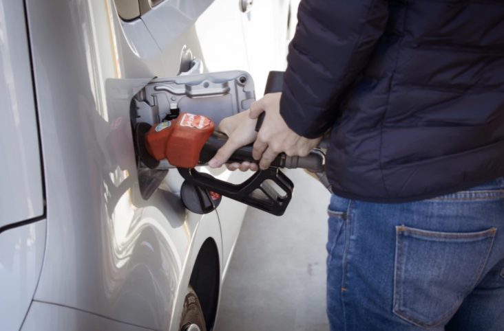 Person pumping gas Person pumping gas
