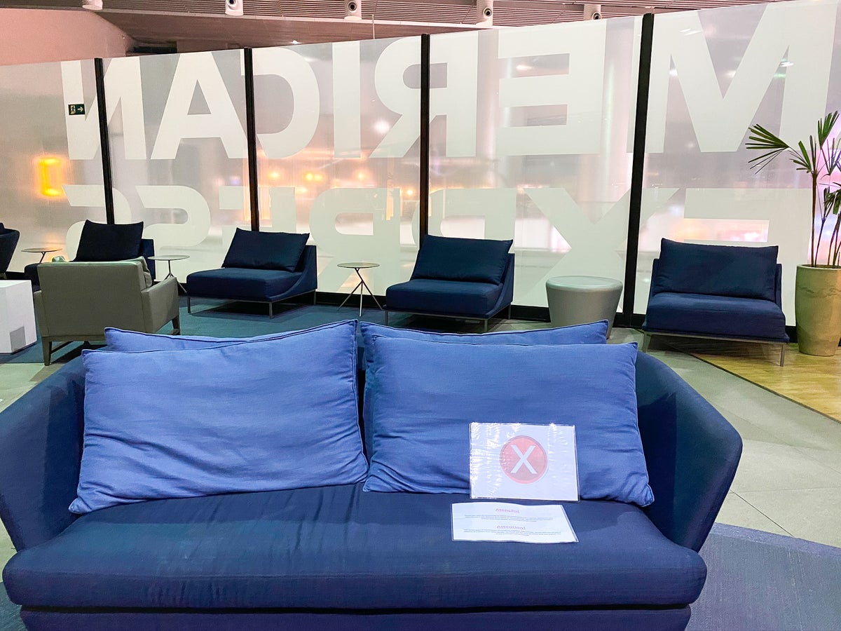 Social distancing couch sign at American Express lounge at GRU Guarulhos International Airport