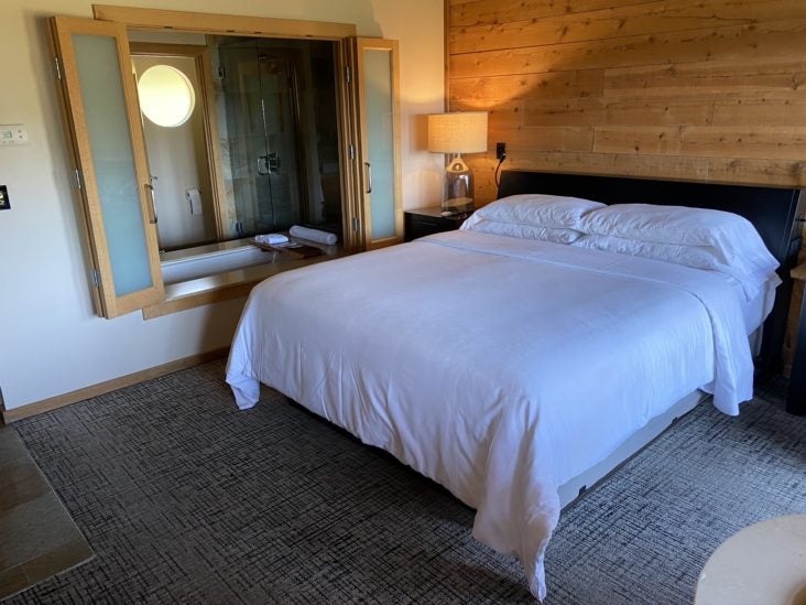 Ventana Big Sur, an Alila Resort Ventana fireplace guestroom bed side view Ventana Big Sur, an Alila Resort Ventana fireplace guestroom bed side view