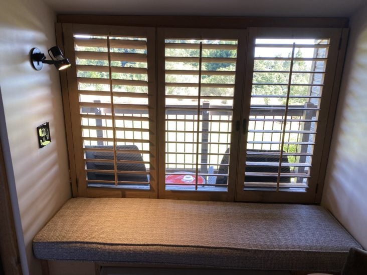 Ventana Big Sur an Alila Resort Ventana fireplace guestroom window nook seat Ventana Big Sur an Alila Resort Ventana fireplace guestroom window nook seat