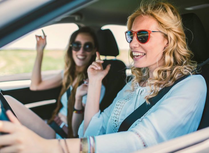 Sixt rental car man driving car Dollar Young Renters 2 Females Sunglasses