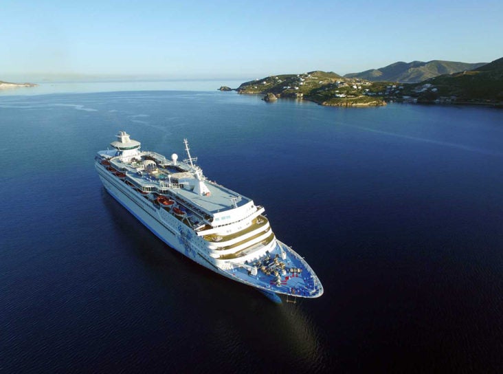 Cruise ship near island Celestyal Cruises Olympia ship