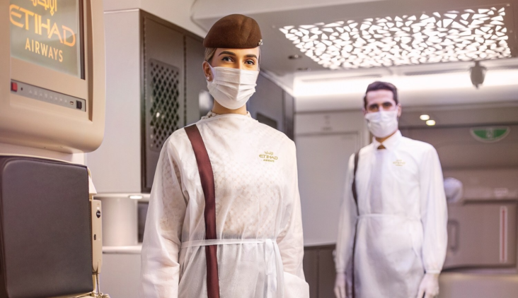 Etihad Crew in PPE Mask and Gown Etihad Crew in PPE Mask and Gown