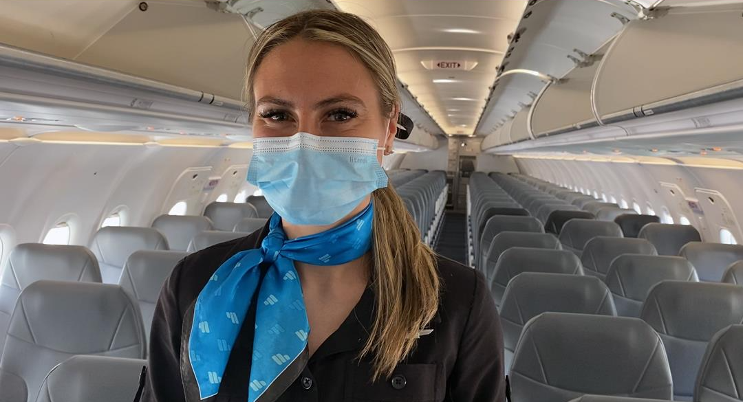 Frontier flight attendant wearing a mask Frontier flight attendant wearing a mask