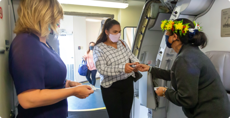 Woman boarding Hawaiian airlines plane Woman boarding Hawaiian airlines plane
