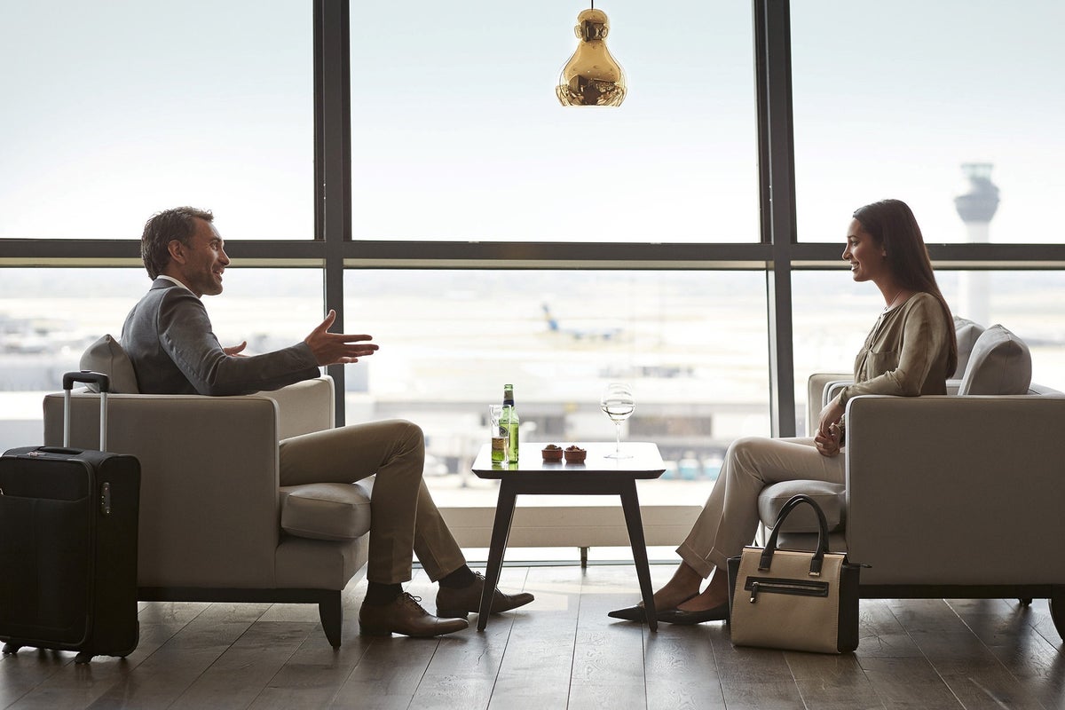 Priority Pass 2 passengers conversing at a lounge