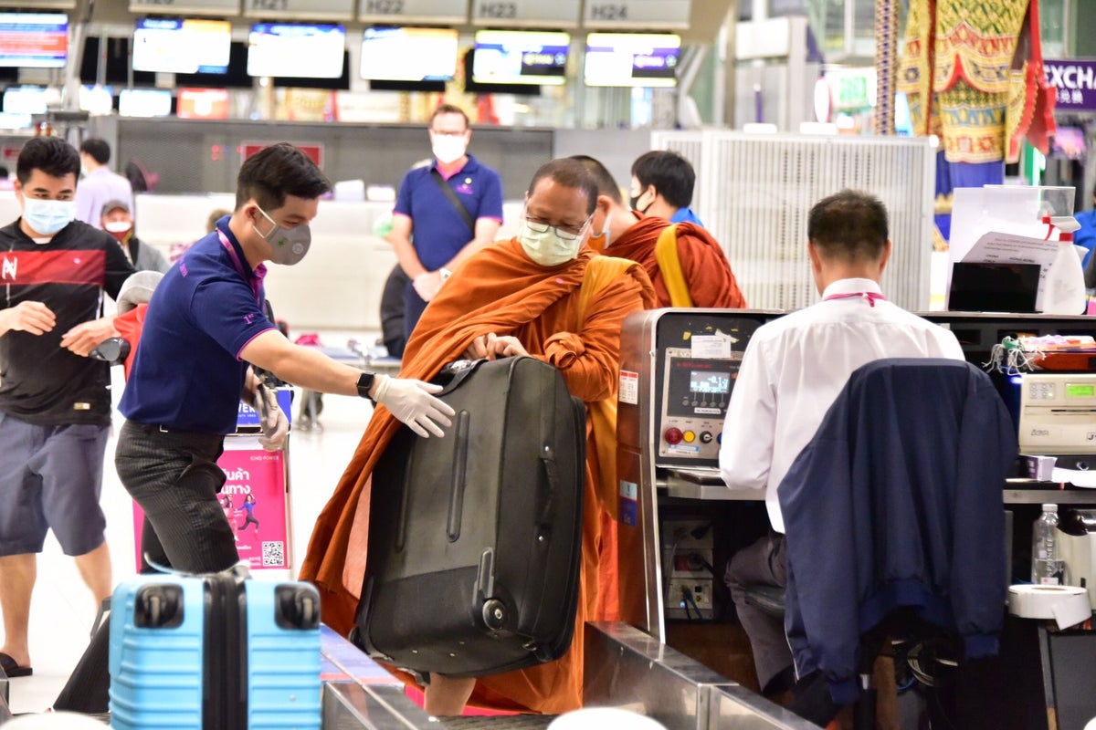 Thai Airways monk at bag drop