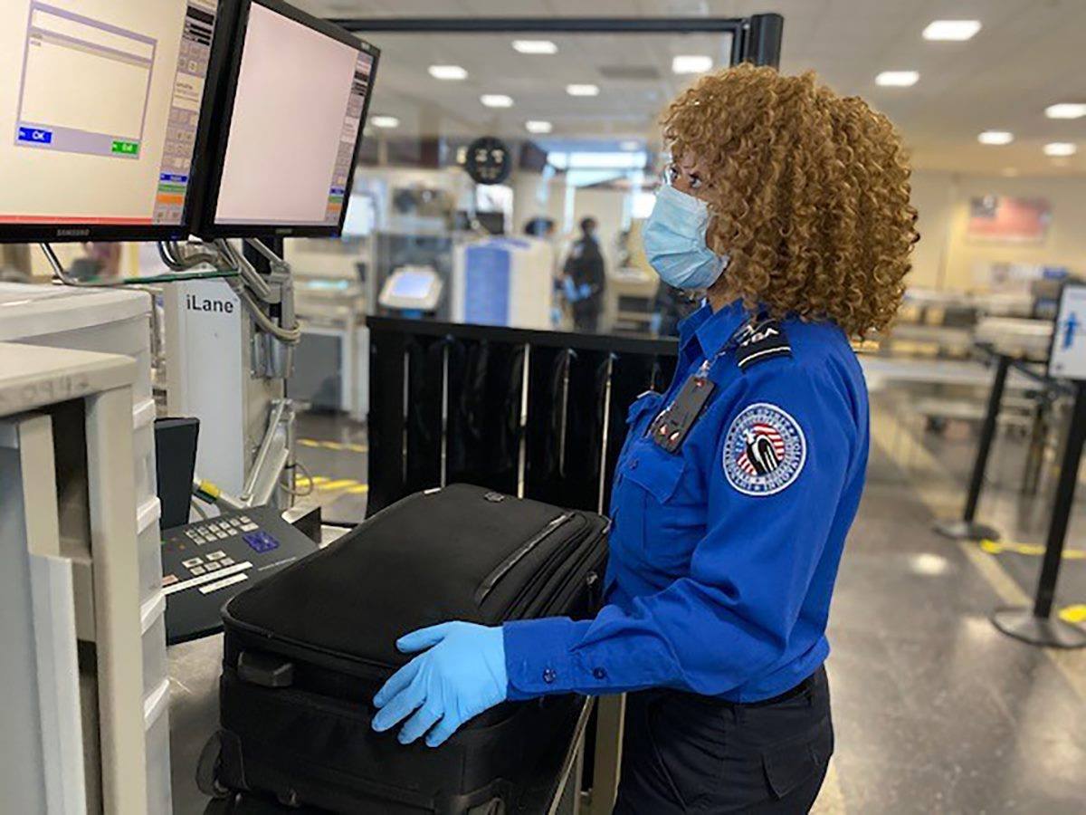 TSA agent looking at screen