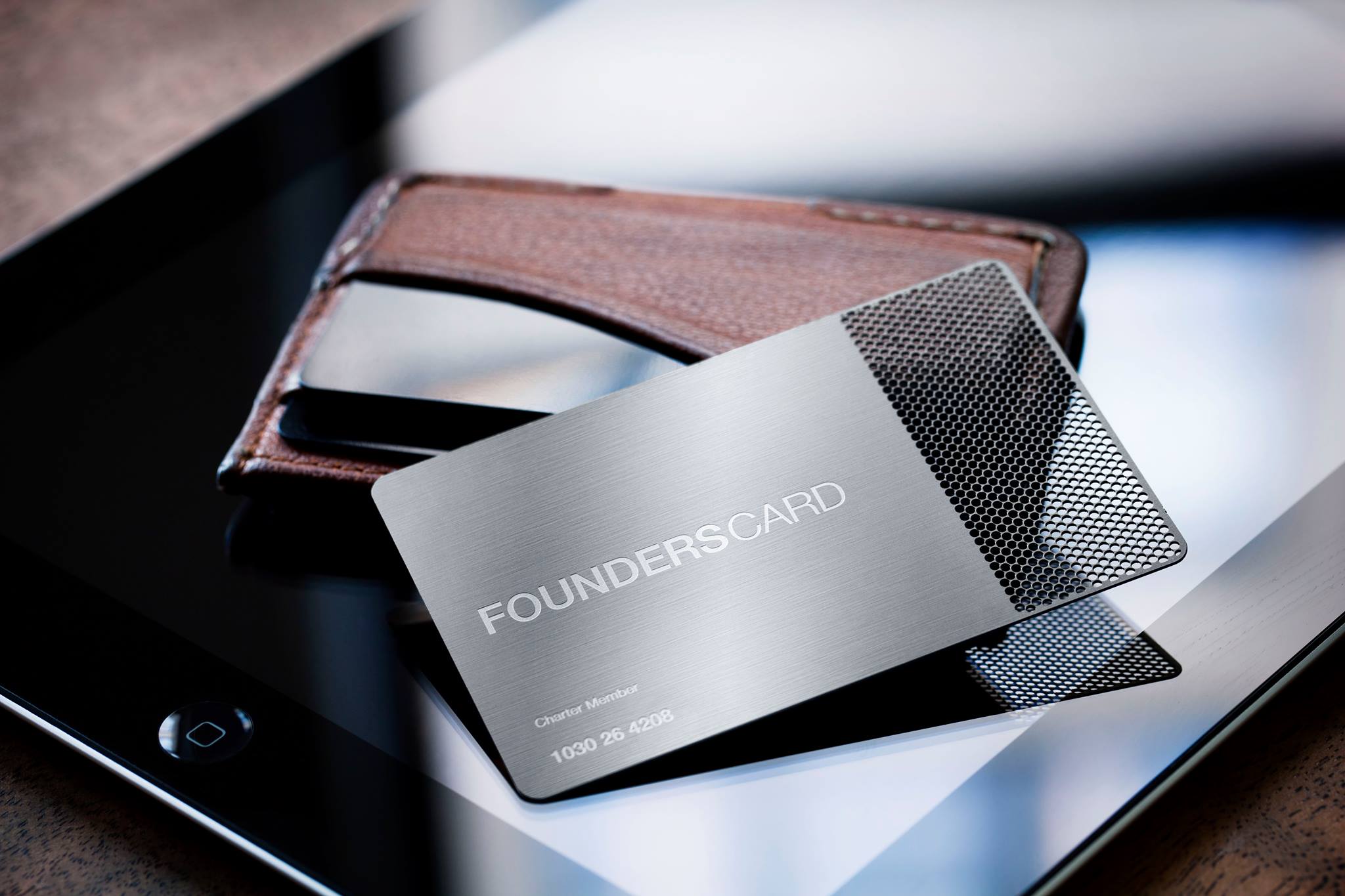 FoundersCard with wallet and tablet