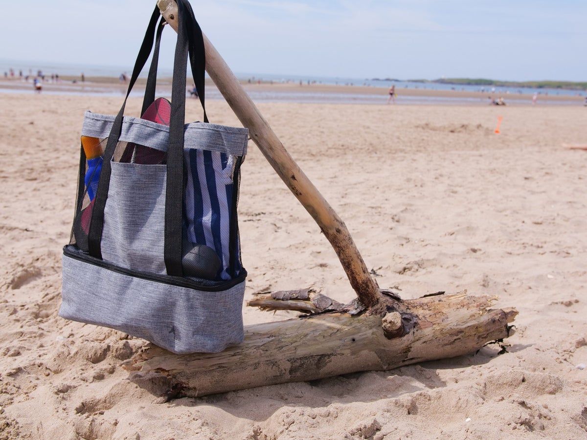 Beach bag on a piece of driftwood