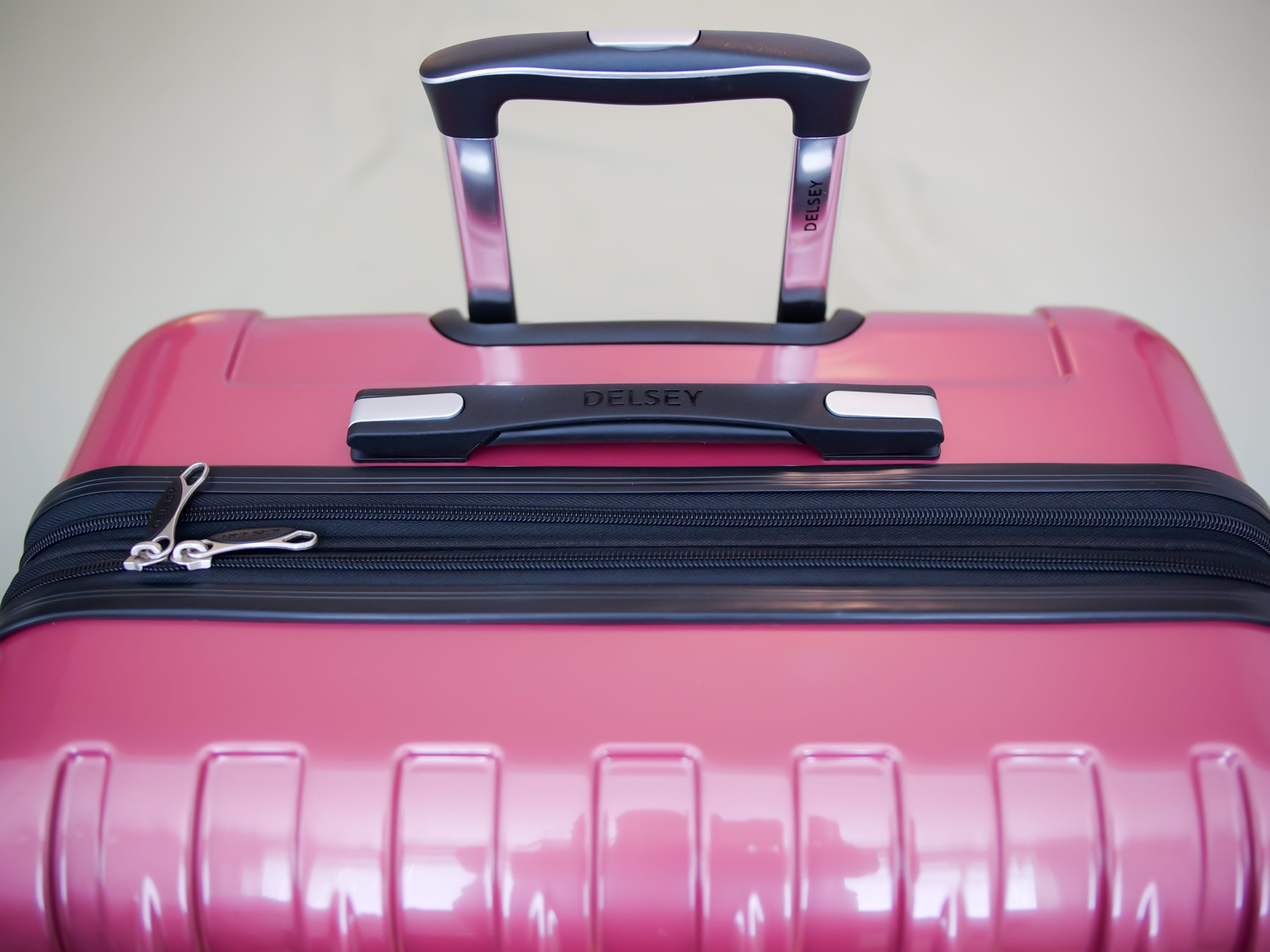 Delsey pink online luggage