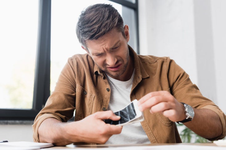 Man with smashed damaged broken phone
