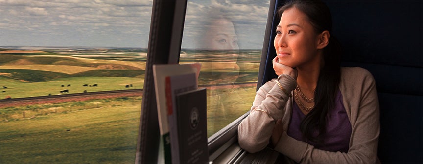 Amtrak traveler looking out of train window