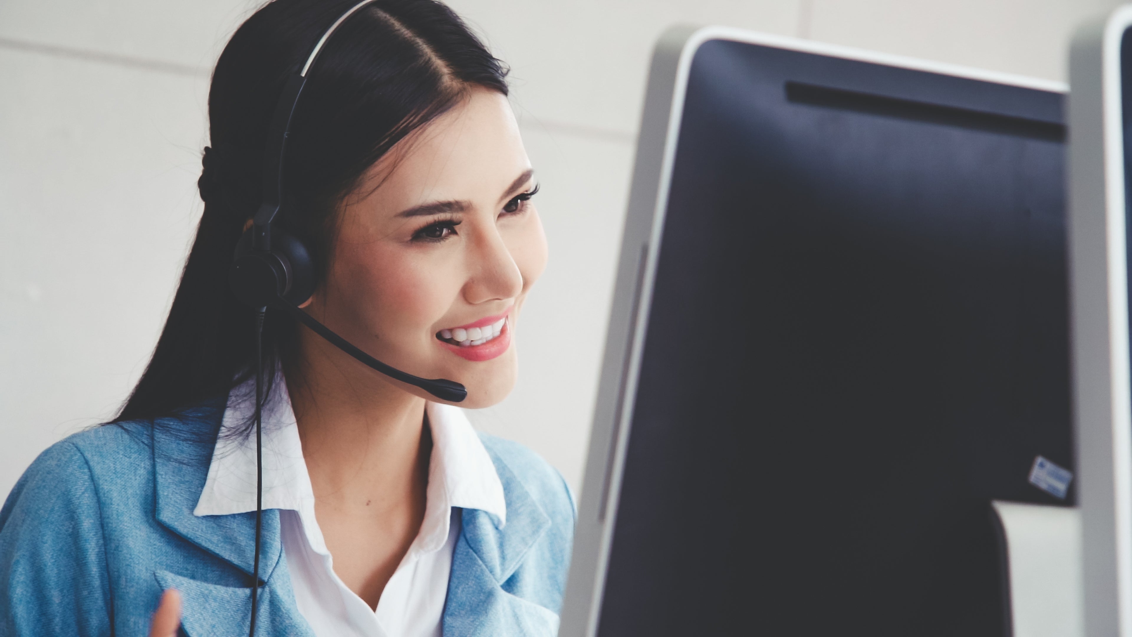 Call center woman smiling on phone